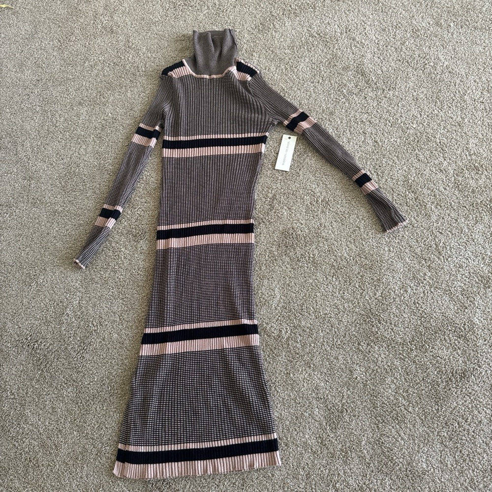 Black and tan striped long sleeve dress with high neck and turtleneck
